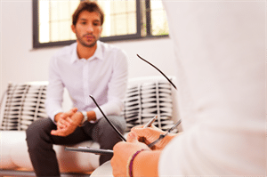 person in counseling on couch