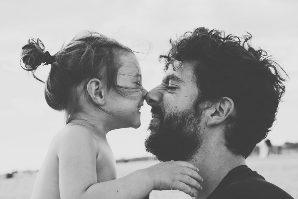 Father and daughter with noses touching