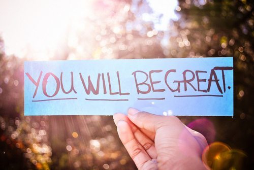 Person holding paper that says You Will Be Great