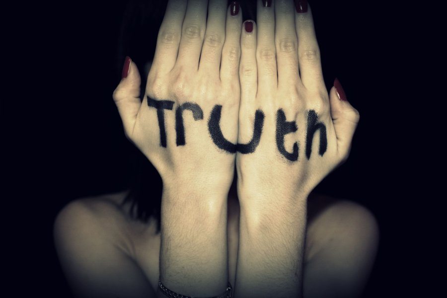 hands with Truth written on them