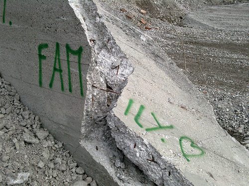 Broken rock with the word family painted on it