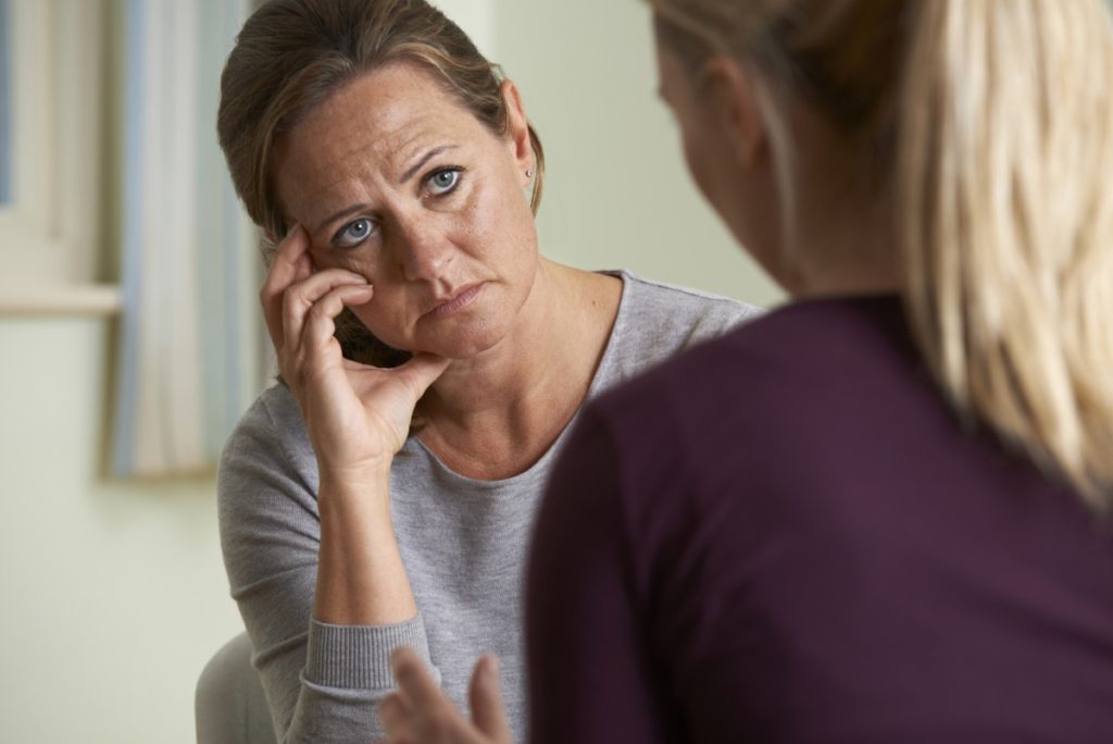 Sad woman talking to daughter