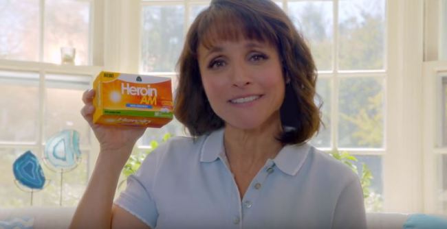 Woman holding package of Heroin AM