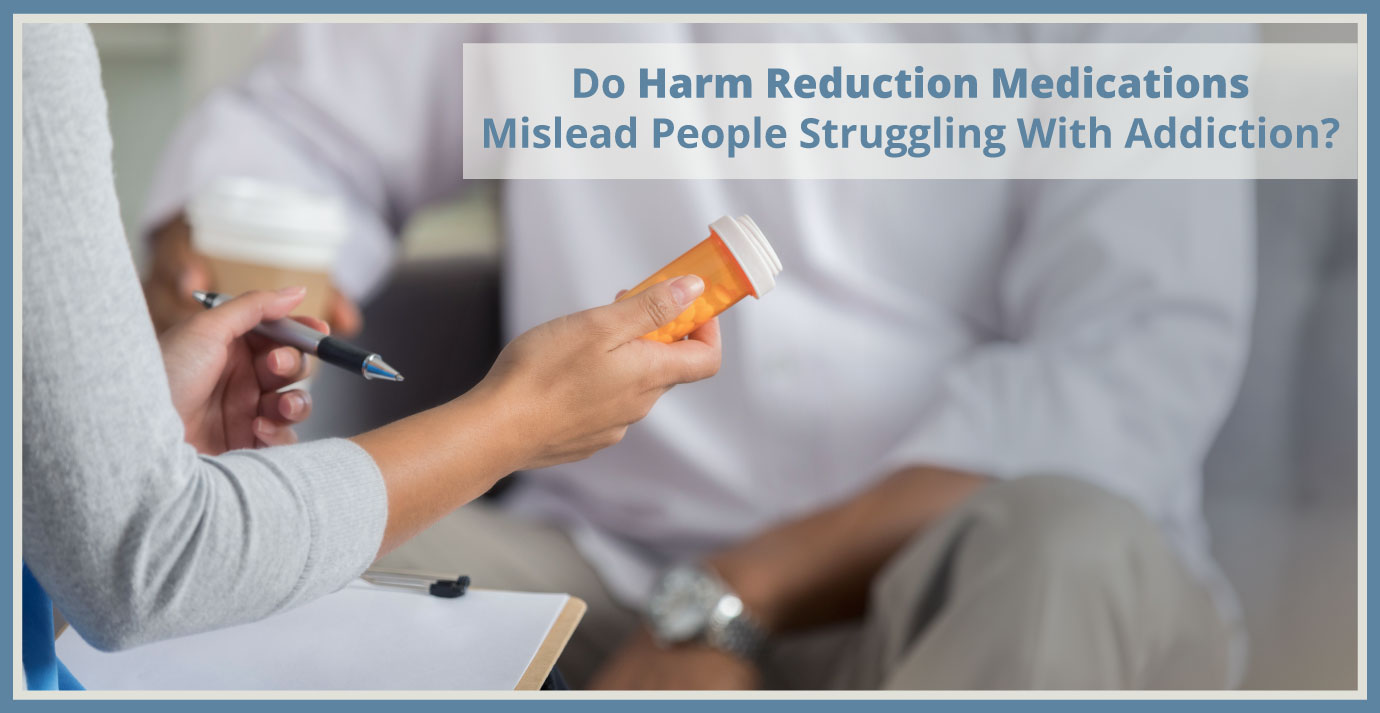 Doctor holding prescription bottle talking to man