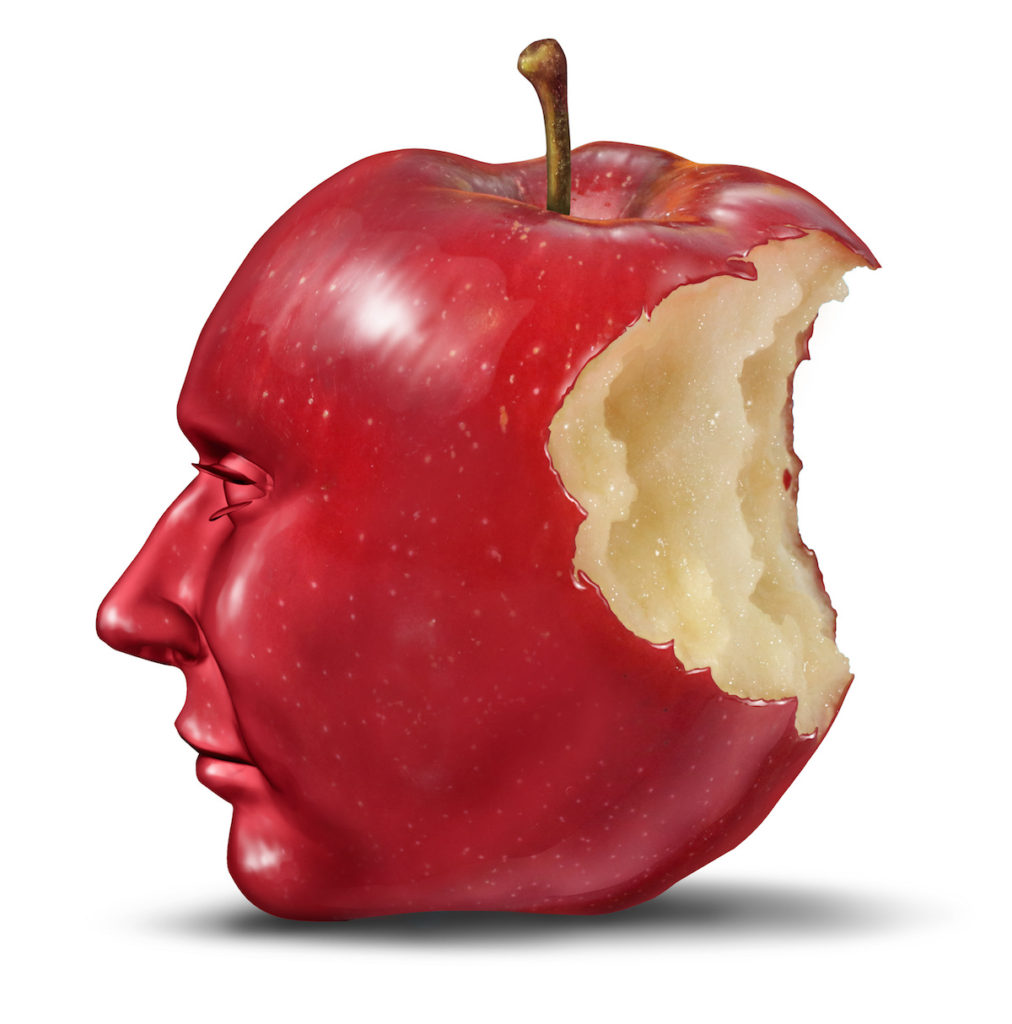 Apple with a bite and a face on it