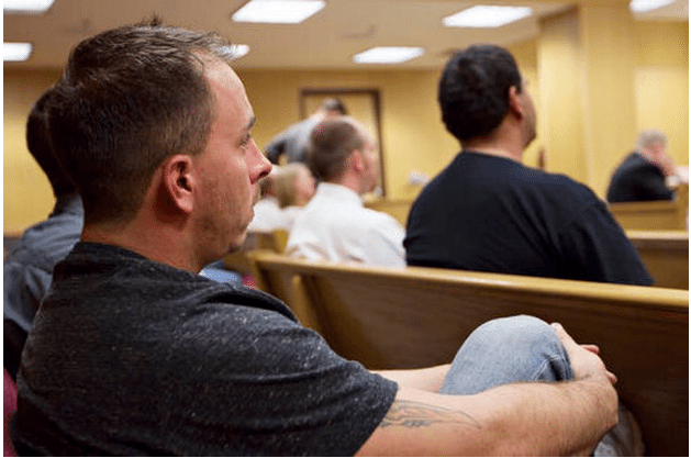 Levi Coy watches the proceedings during a session of Adult Treatment Court on Sept. 27, 2016, at the Campbell County Courthouse in Gillette, Wyo. Most of Personal Frontiers, an addiction recovery organization, clients are referred through the legal system. The Adult Treatment Court contracts with the agency to provide services for everyone in the program. Gillette News Record via AP Steel Brooks