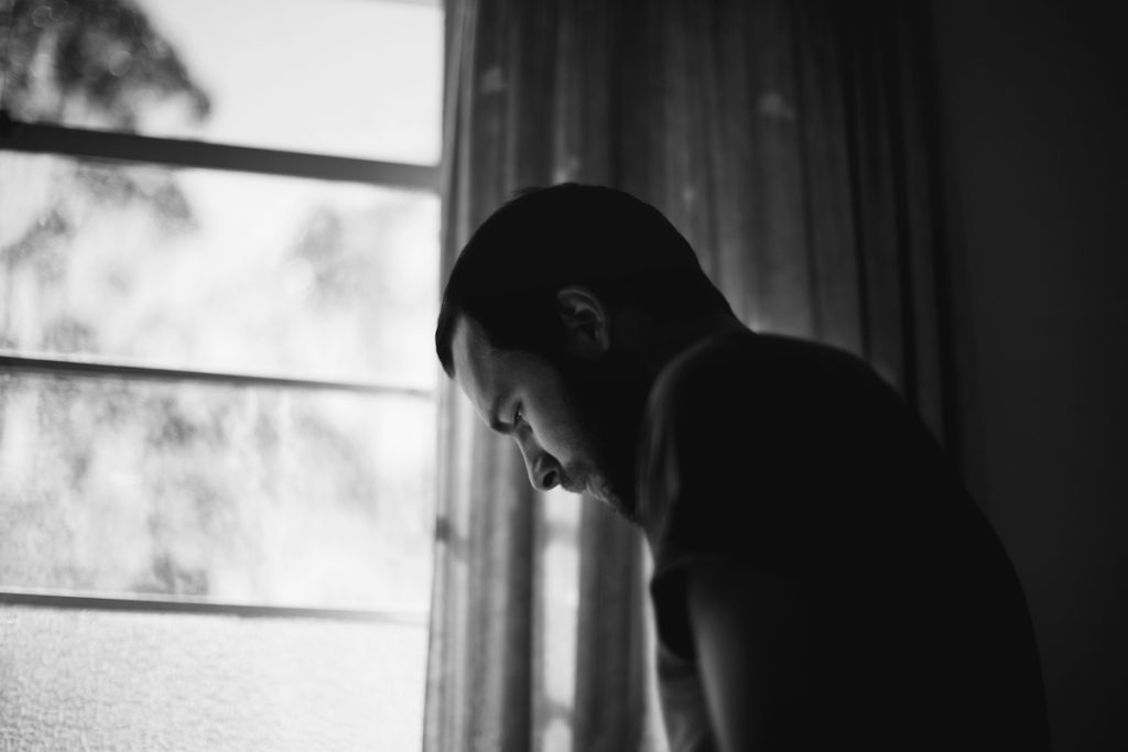 Black and white image of man looking down