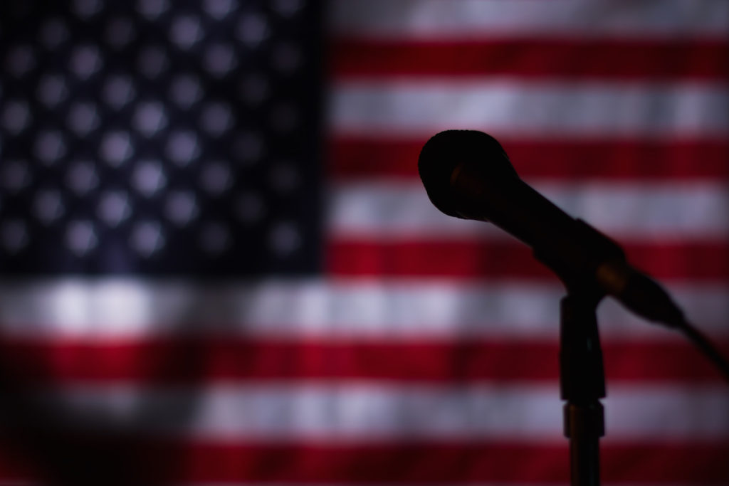 Microphone with an American flag in the background