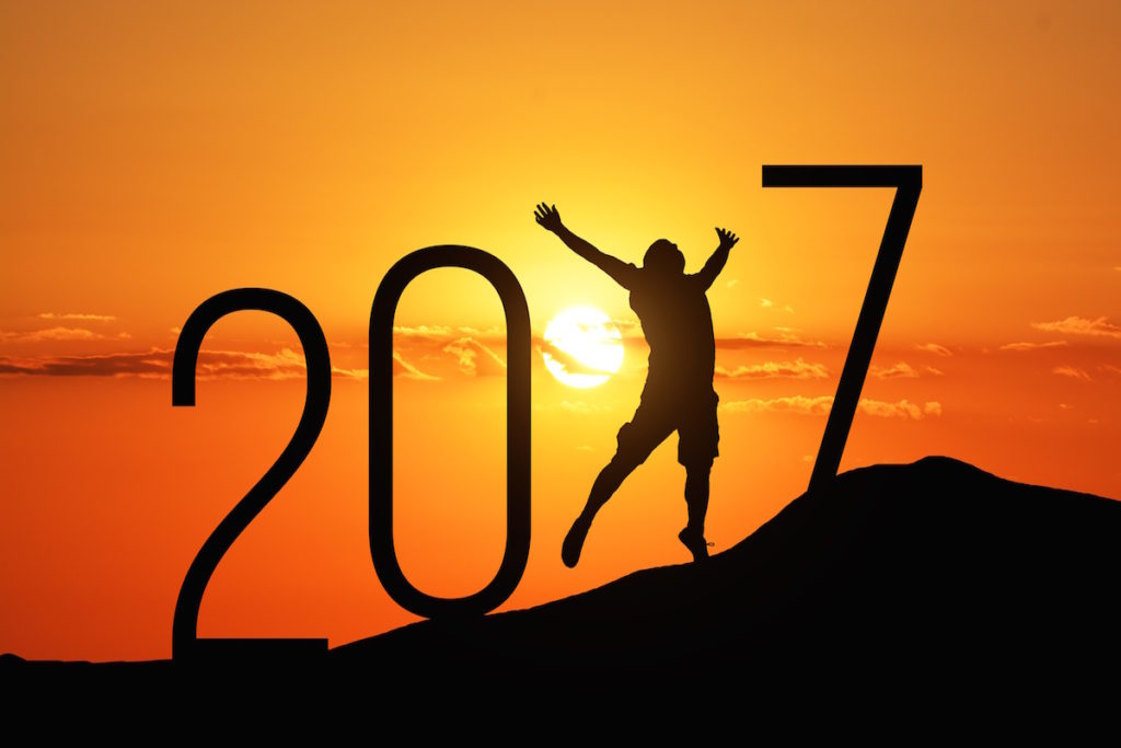 2017 with sunset in the background and man jumping to form the 1