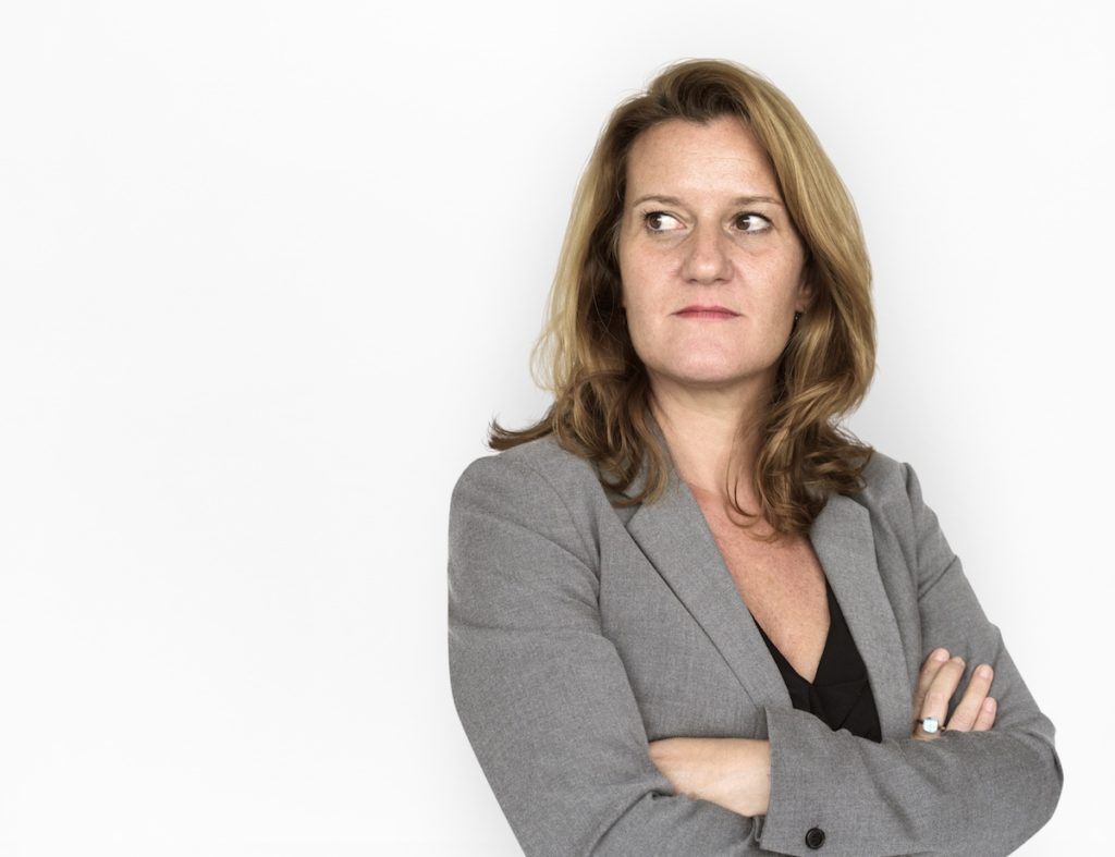 Woman in suit looking upset