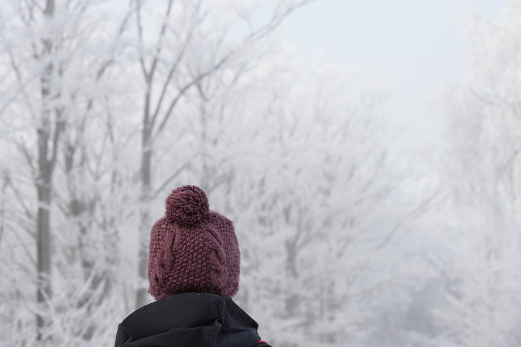 Woman wearing hat in the snow