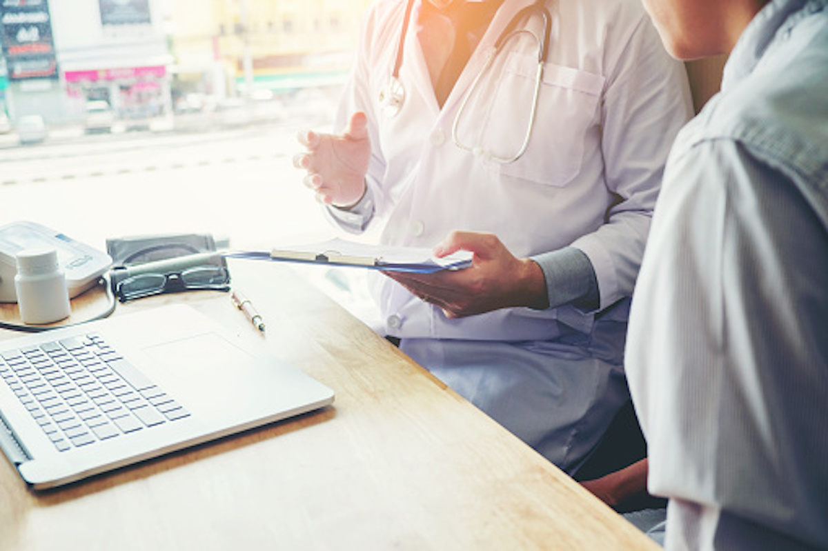 Physician talking to another person