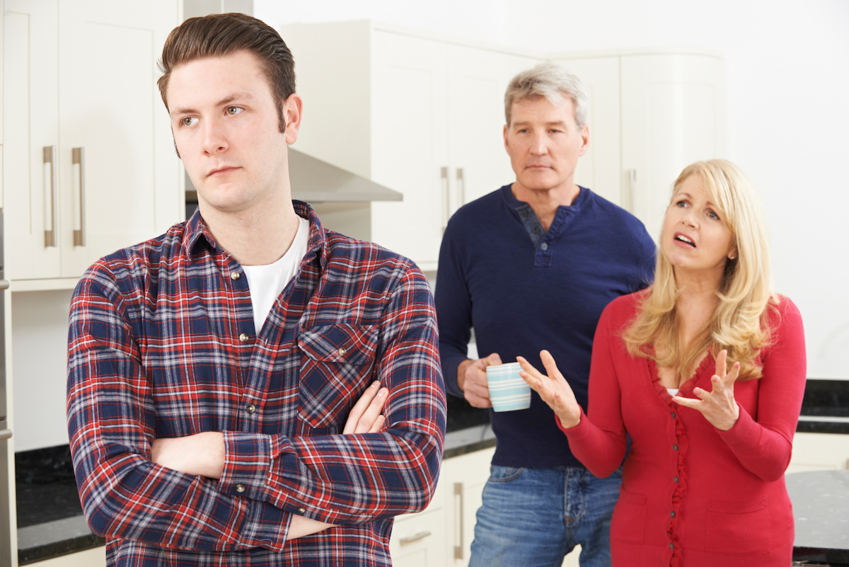 Son back turned to mother and father