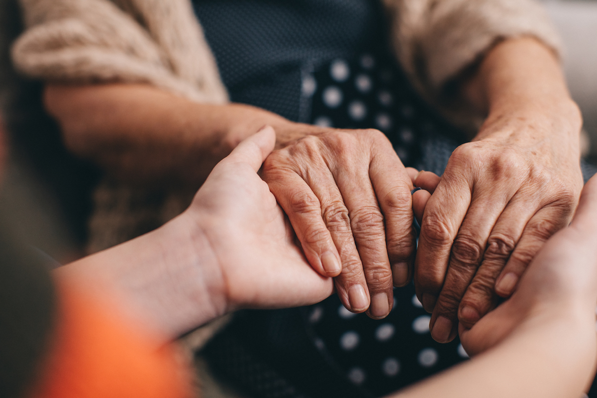 Grandmother and granddaughter holding hands