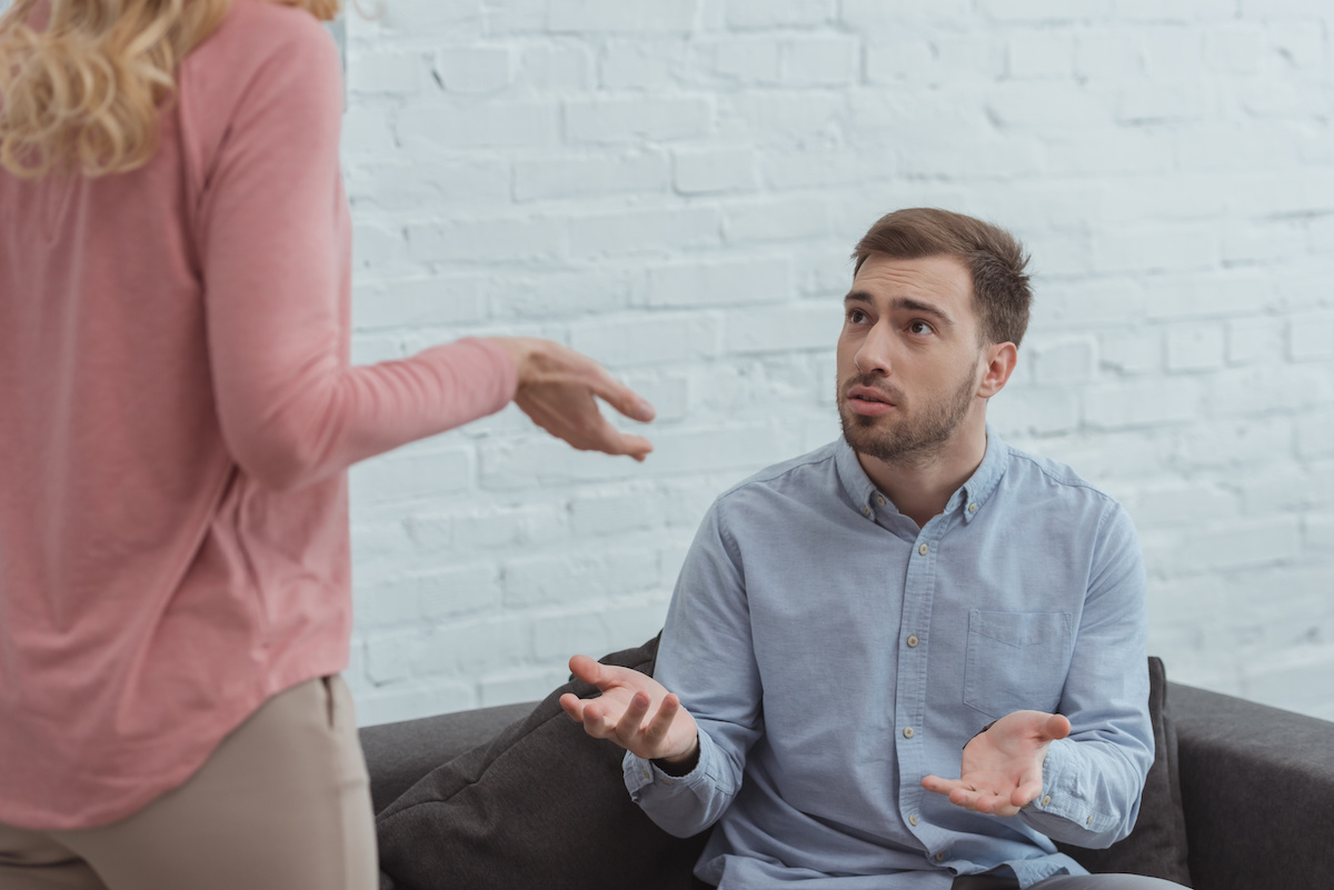 Confused Man and woman talking