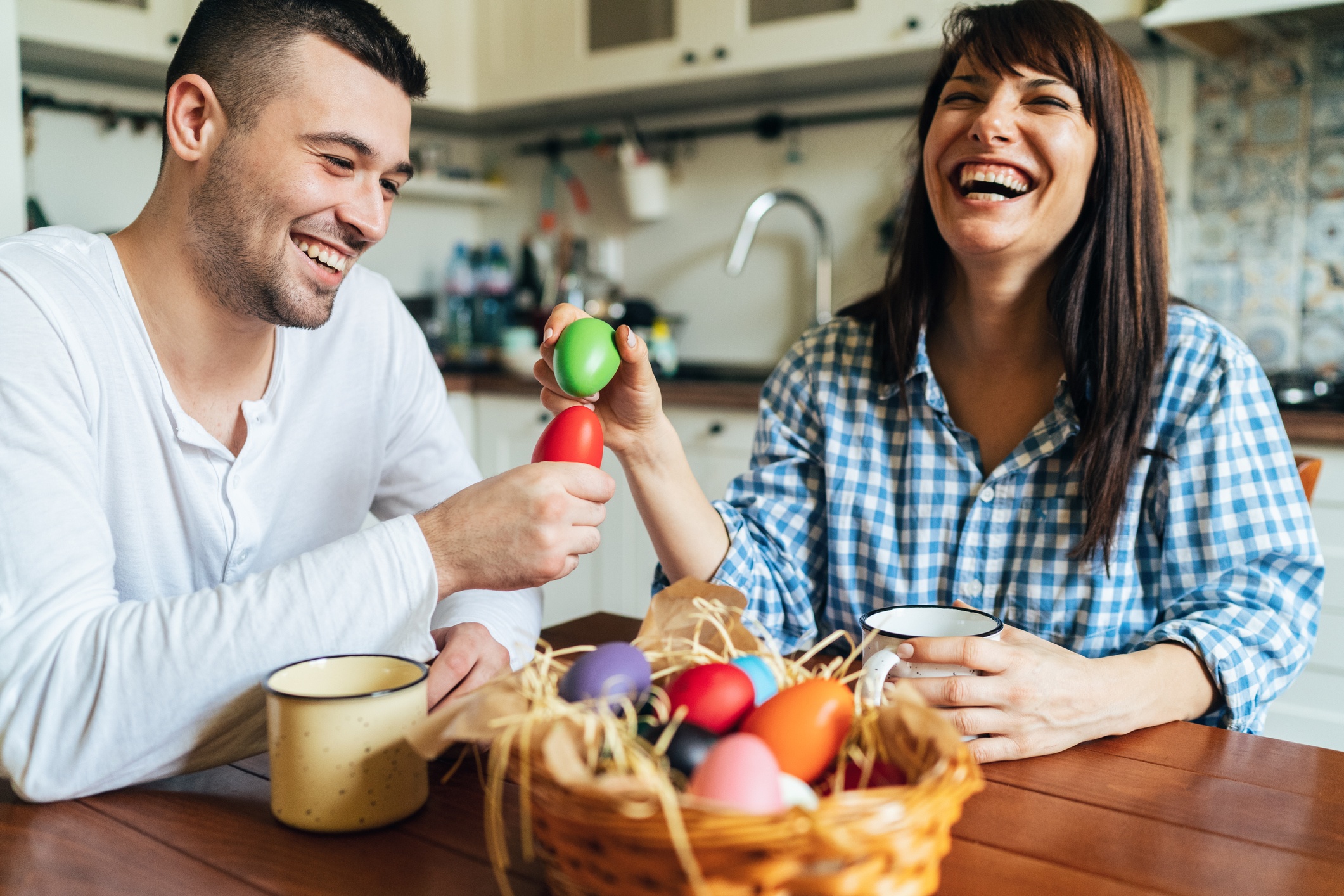 Couple laughing with Easter basket