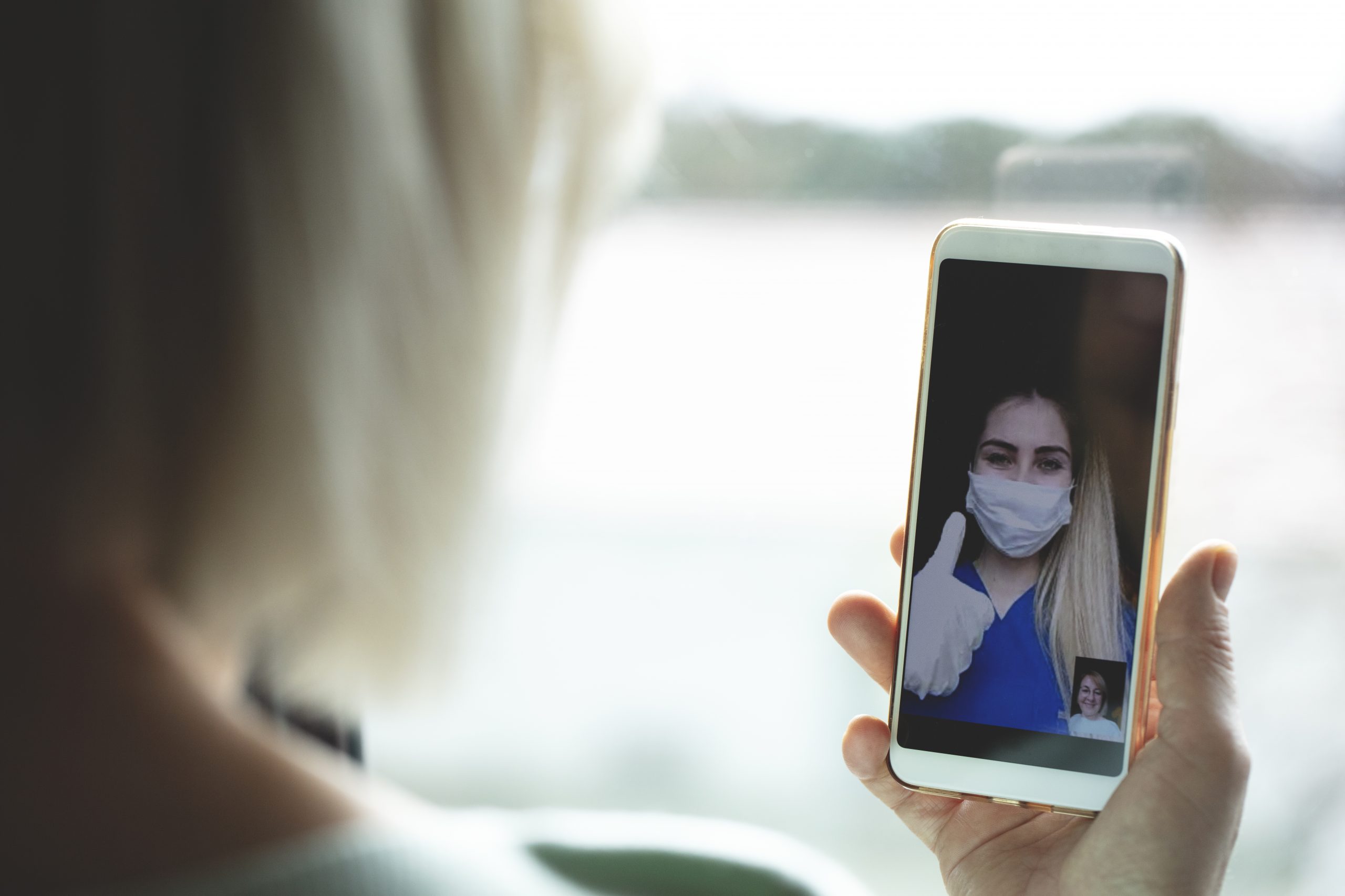 Woman and medical professional facetiming