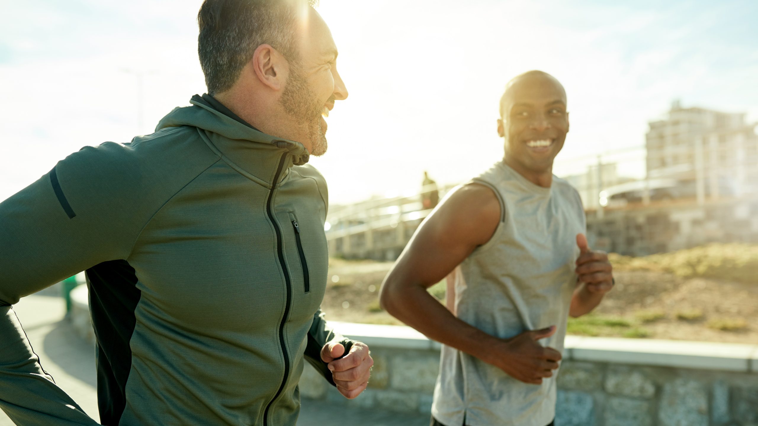 Two men running and smiling