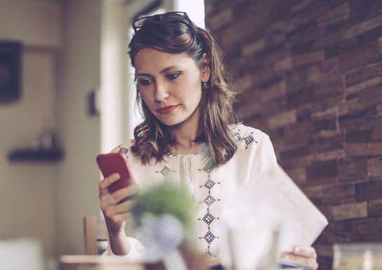woman looking at phone