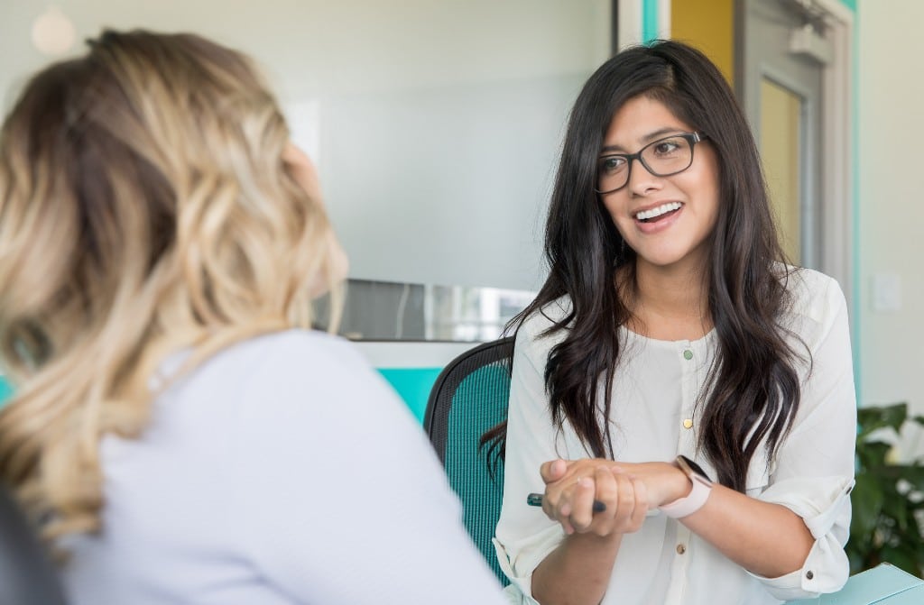 Therapist and woman talking to each other