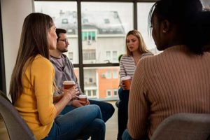 a group discusses addiction in a Drug Addiction Treatment program