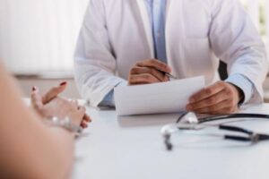 a doctor discusses american choice rehab insurance coverage with a patient