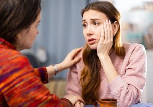 Woman wondering how to help someone addicted to heroin