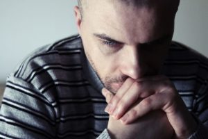 Man struggling with post-acute withdrawal syndrome